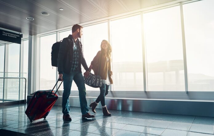 Luggage,,Travel,And,Walking,With,Couple,In,Airport,Together,For
